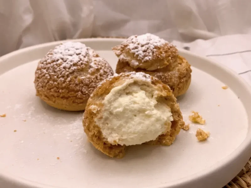 Cream-filled choux pastry on plate