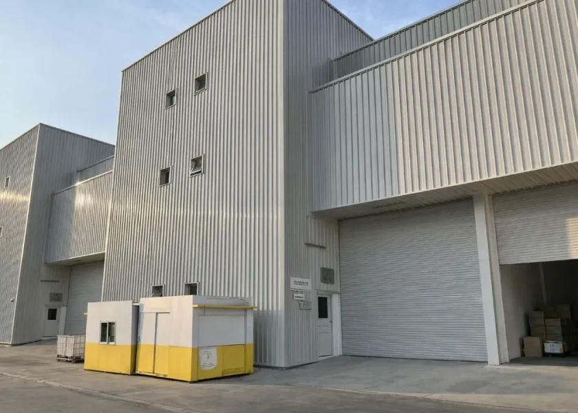 Industrial warehouse complex with yellow kiosk